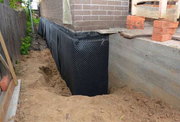 Happy homeowners after waterproofing job in Vestaburg
